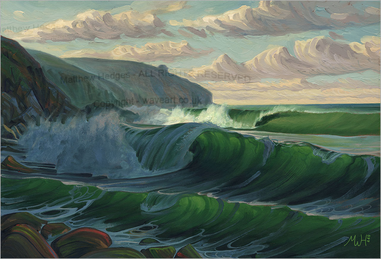 Waves breaking at Hendra Beach as one sits below the rocks.